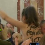 Topless woman disrupts Marine Le Pen speech and calls her a ‘pretend feminist’