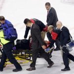 Scary pictures of Eddie Läck stretchered off ice after violent collision