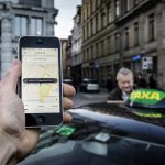 Uber halts services in Denmark after new taxi law