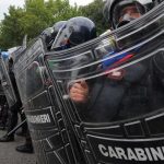 Police officers injured in clashes outside Italy G7 meet
