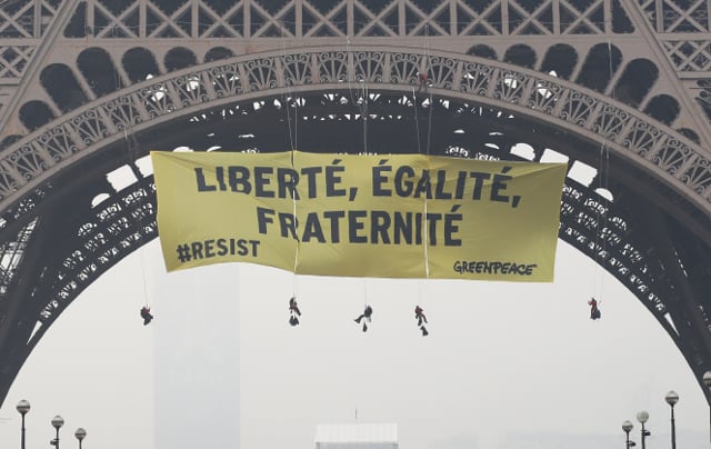 Greenpeace stage Eiffel Tower demo urging French voters to 'resist' Le Pen