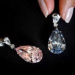 Diamond earrings sold for record $57m at Geneva auction