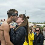 The winner of the annual 'Naked Run' held at the Dream City camp is congratulated by his girlfriend.Photo: Ida Guldbæk Arentsen/Scanpix