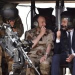 Macron visits French air base hoping to smooth over crisis with military