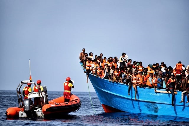 Italy agrees to draw up migrant rescue ‘code of conduct’ with France and Germany