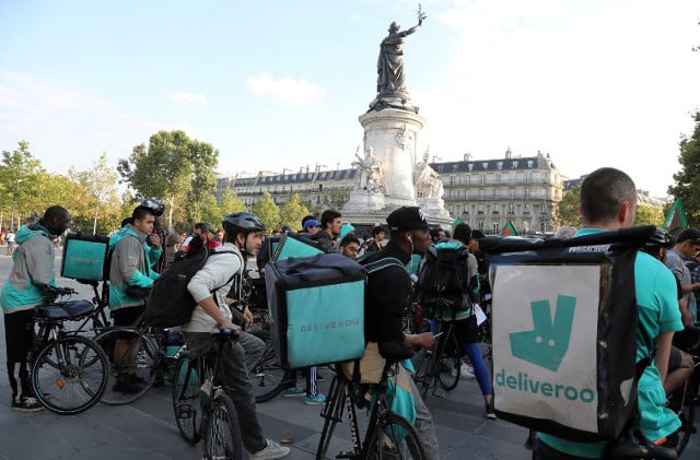 France's delivery bike riders take to the streets to protest salary changes