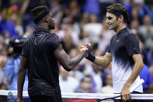 Federer battles through tough test to advance in US Open