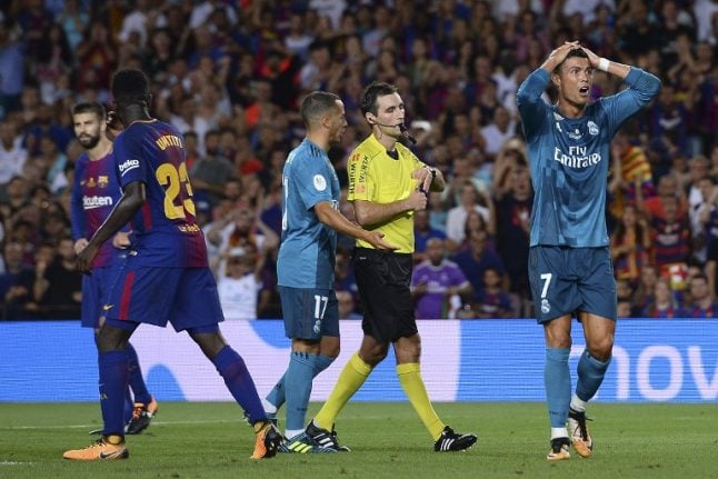 Real Madrid’s Ronaldo risks long ban for pushing ref in Barcelona clash