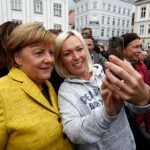 ‘Bring home the bacon,’ Merkel tells voters on eve of poll