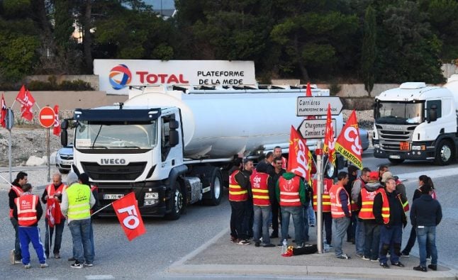 Roads and fuel depots blocked across France as truck drivers protest labour reforms