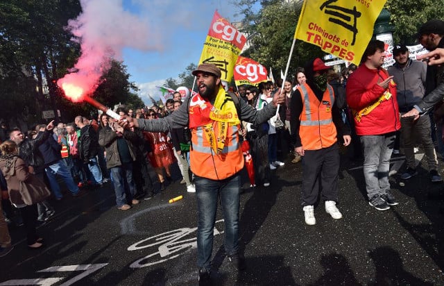 Tens of thousands take to the streets to protest Macron's labour reforms