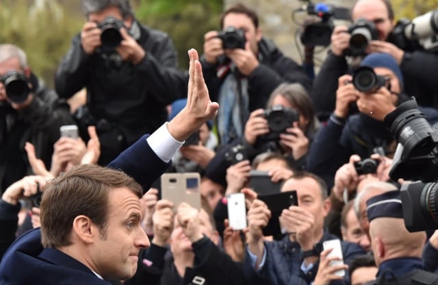 Macron withdraws legal complaint against press photographer who 'harassed' him on holiday