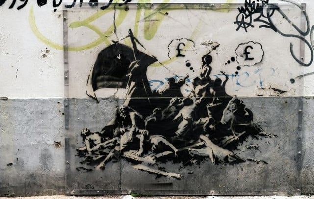 Banksy mural in Calais wiped out by house painters