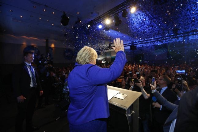 Norway’s PM Solberg claims victory in close election
