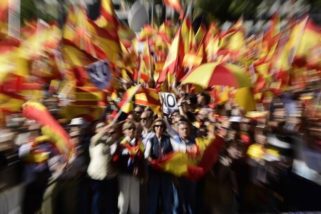 Thousands rally in Madrid, urge jailing of deposed Catalan leader
