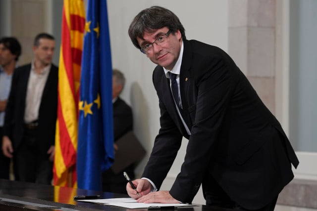Allies press Puigdemont to lift suspension on independence declaration