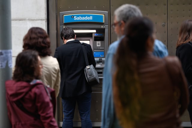 Catalan separatists make mass cash withdrawals in protest