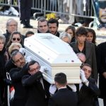 France sees boom in bizarre Johnny Hallyday memorabilia (including photo of rocker in his coffin)