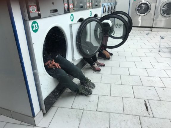 Photo of street kids seeking warmth in tumble dryers shocks Parisians