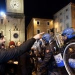 Far-right demonstrators clash with police at banned protest in Macerata
