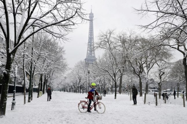 In pictures: Paris wakes up to spectacular snowy scenes
