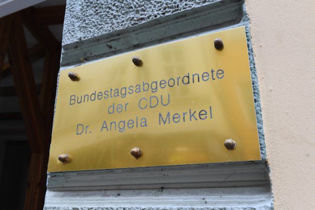 Far-right group protests with funeral candles at Merkel’s office after Freiburg murder verdict