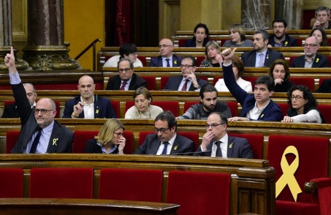 Catalan parliament slams Madrid 'authoritarianism', defends Puigdemont