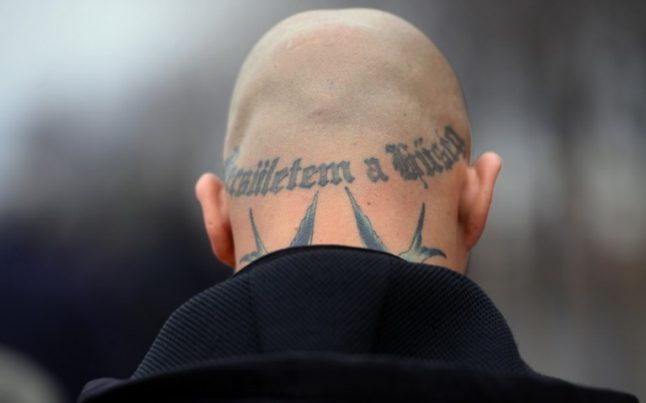 Swiss neo-Nazi who spat on Jew jailed for two years