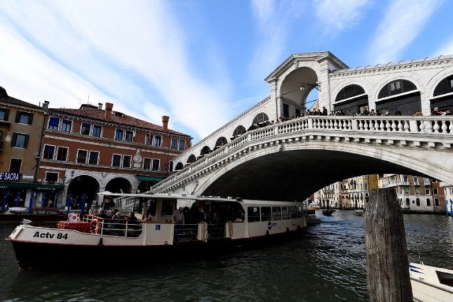 Venice threatens legal action after tourists dive off Rialto Bridge