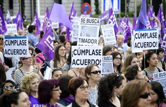 Women take to the streets in Spain demanding funds to fight domestic violence