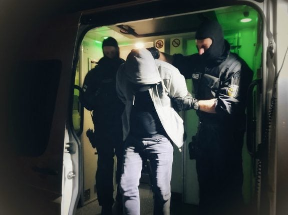 Police raid migrant smuggling network with connections to far-right