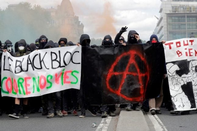 Who were the black-clad rioters in Paris and how can France stop them?