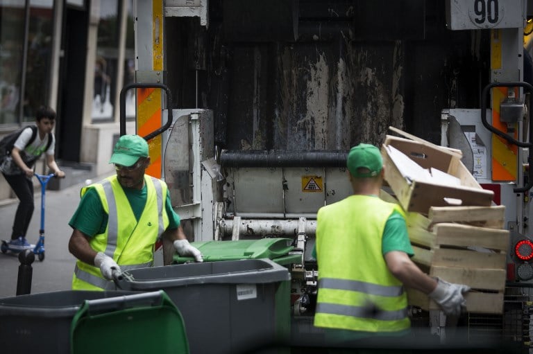 Paris police hold two garbagemen planning smelly Macron protest