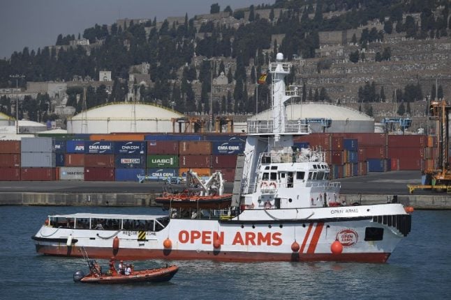Open Arms ship with 60 migrants aboard docks in Barcelona