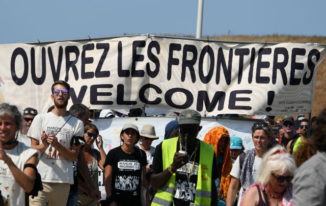 Four activists held in France for escorting migrants over border