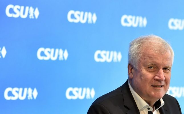 German interior minister offers to resign in migration showdown with Merkel
