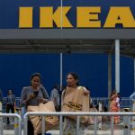 Customers return after shopping at Ikea's first store in India.Photo: AP Photo/Mahesh Kumar A