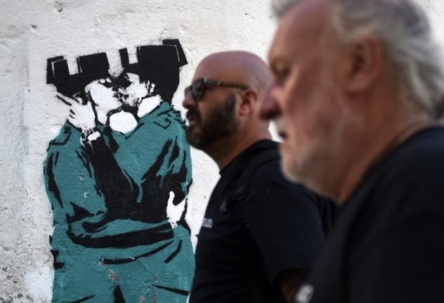 Mural of Spanish police officers snogging 'not a Banksy' after all