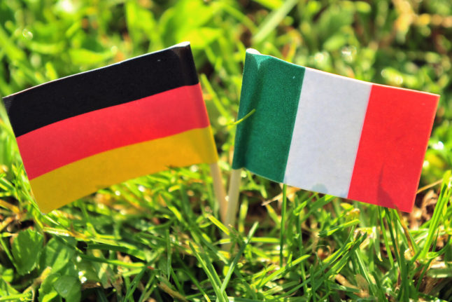 The German and Italian flags are stuck in the lawn of a garden in Chemnitz.