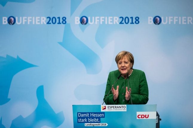 Merkel on the spot after painful vote in Hesse