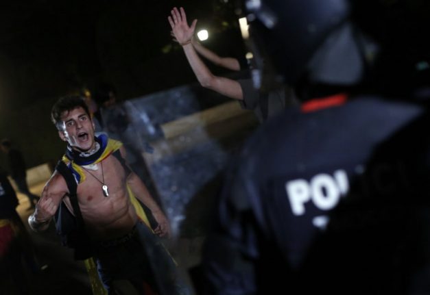 Spanish PM raps Catalan leader after unrest in Barcelona