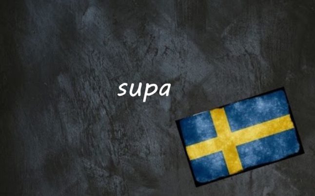 the word supa written on a blackboard next to the swedish flag