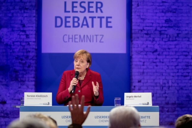 Merkel defends refugee decision in protest-hit Chemnitz