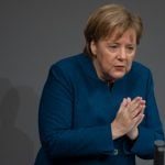 Merkel defends UN migration pact amid party split on issue