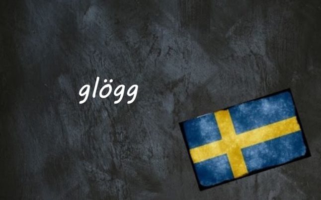 the word glögg on a black background next to a Swedish flag