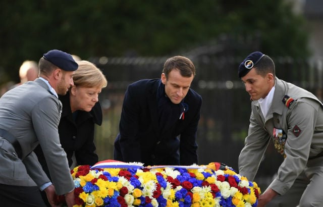 Macron and Merkel lay wreath at WW1 armistice site