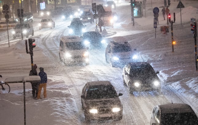 File photo of cars on a snowy street in Stockholm