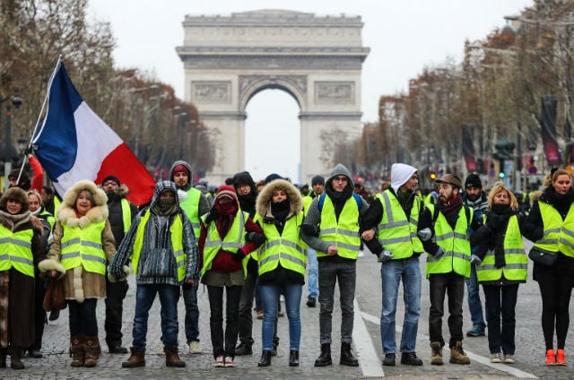France's 'yellow vest' protests calmer on decisive weekend