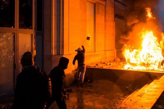 'It's burning': Scenes of urban warfare rock Paris