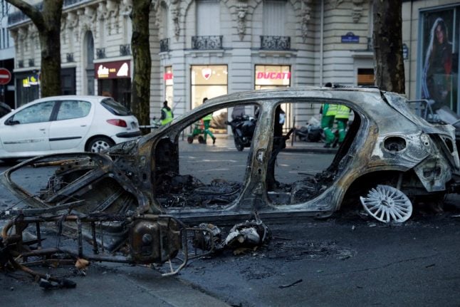 Paris in pictures: Abandoned barricades and burned cars